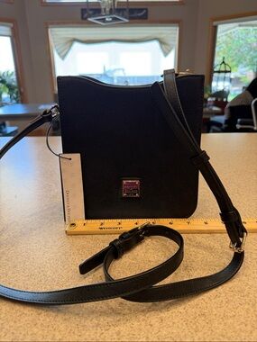 NWT Dooney & Bourke Black Crossbody/shoulder bag  “Letter Carrier” gold hardware